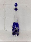 An overlaid and cut blue glass decanter