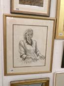 A pencil drawing of a lady at piano initialed J N 1989