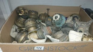 A large quantity of oil lamp burners