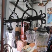 A 4 lamp wrought iron ceiling light