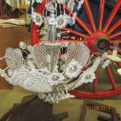 An 8 light basket chandelier