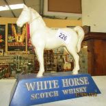 A White Horse scotch whisky advertising figure