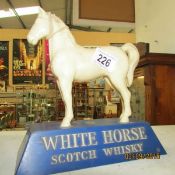 A White Horse scotch whisky advertising figure