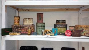 A collection of advertising tins