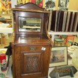 An oak coal cupboard with mirror back and fall front