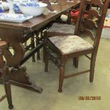 An oak dining table and 6 chairs