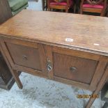 An oak 2 door cabinet