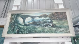 A framed print of a steam engine