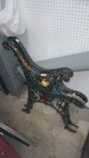 A pair of cast iron bench ends