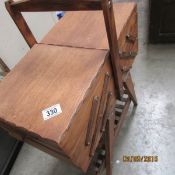 A concertina sewing table