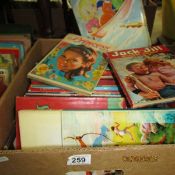 A box of children's annuals and books