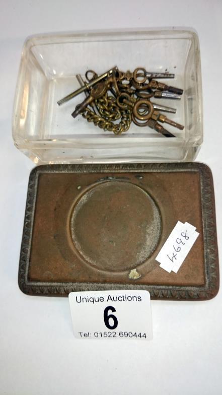 A Victorian glass trinket box with pocket watch keys