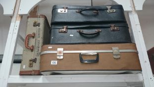 4 vintage suitcases