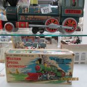 A boxed tin plate locomotive