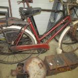 A vintage ladies bike with child seat