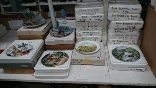 A very large collection of limited edition plates,