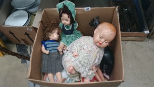 A box of vintage dolls,