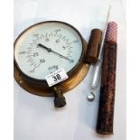A pressure gauge & thermometer with original case