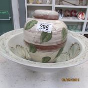 A large pottery bowl and a lidded pot