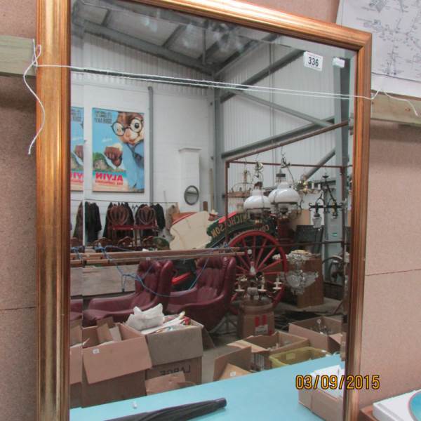 A gilt framed bevel edged mirror