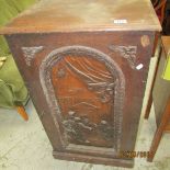 A carved oak cupboard