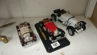 Three Mercedez die-cast cars