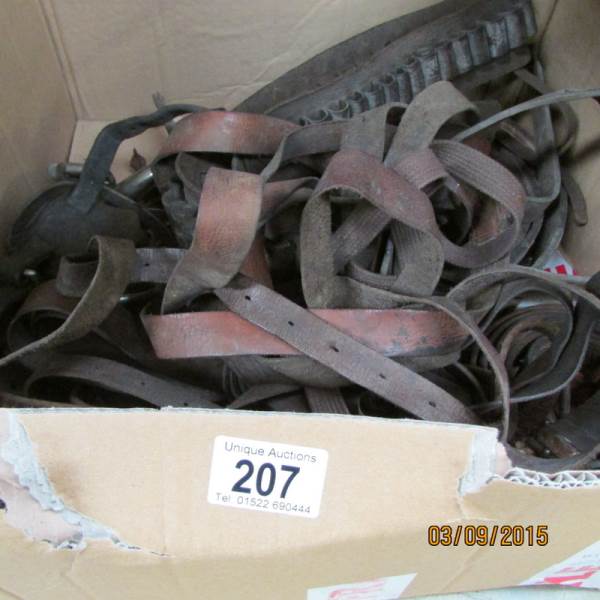 A quantity of leather straps, gunbelt,
