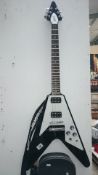 An electric Flying V guitar with custom hard case