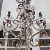 A 4 light glass and beaded chandelier