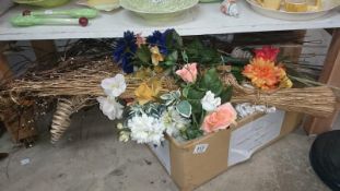 A box of artificial and dried flowers