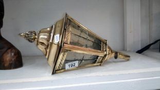 An Edwardian exterior brass wall lantern