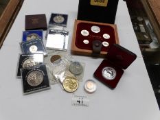 A quantity of collector's crowns and medallions including Canada silver dollar and coin set