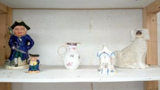 A mixed lot including Staffordshire Toby jugs, Coalport, Caughley mask head jug,
