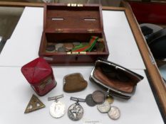 A mixed lot of mainly UK coins, an old wooden money bank,