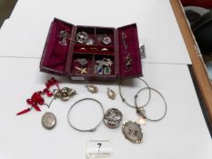 A jewellery box and contents including silver brooches etc