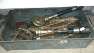 A box of old beer pumps