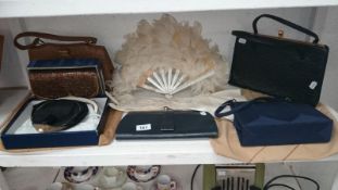 A quantity of evening bags, feather fan,
