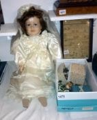 A porcelain doll in wedding dress and a box of vintage dolls etc