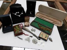 A mixed lot of costume jewellery including a Georgian needle case,