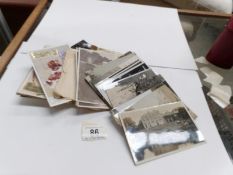 A quantity of old photographs and postcards,