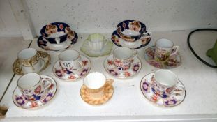 A quantity of porcelain cups and saucers including Worcester,