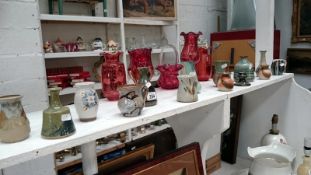 A quantity of small studio pottery vases and jugs