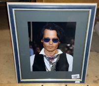 A Johnny Depp signed photograph in frame