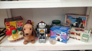 A quantity of vintage battery operated toys including robots,