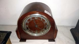 A British made mantel clock with pendelum and key
