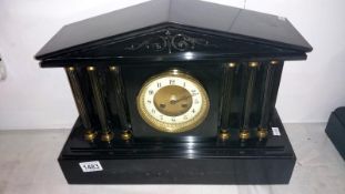 A black slate Paladian style mantel clock converted to battery movement