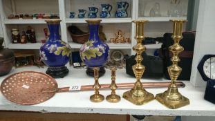 2 pairs of Victorian brass candlesticks and an old copper skimmer