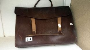 A leather satchel of sheet music