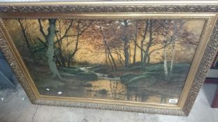 A large gilt framed and glazed forest print