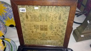An oak framed sampler dated 1824